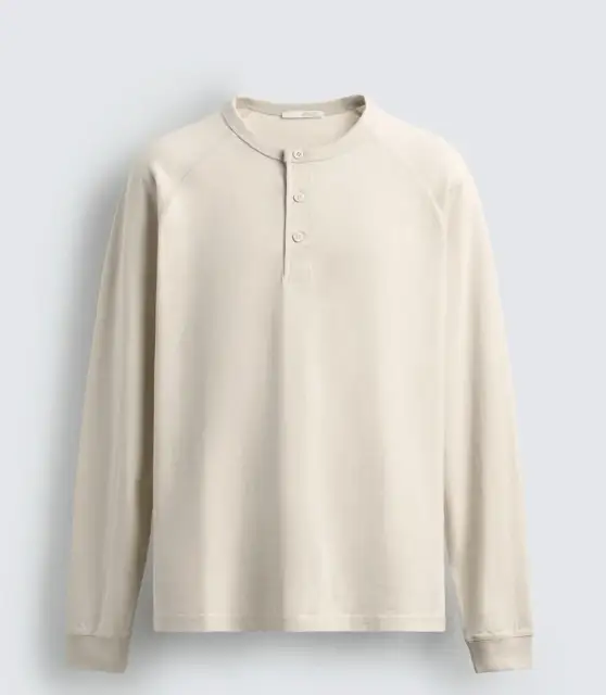Source: a cream long-sleeve henley, cut-out
