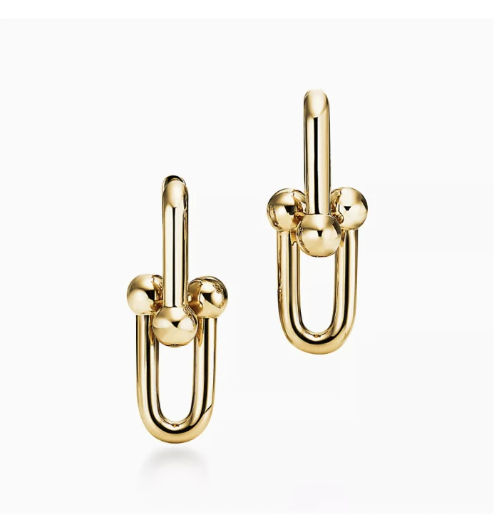 Gold link earrings, product photo on white