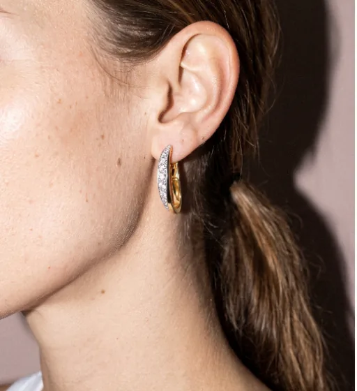 Earrings in the same studio direction, generated