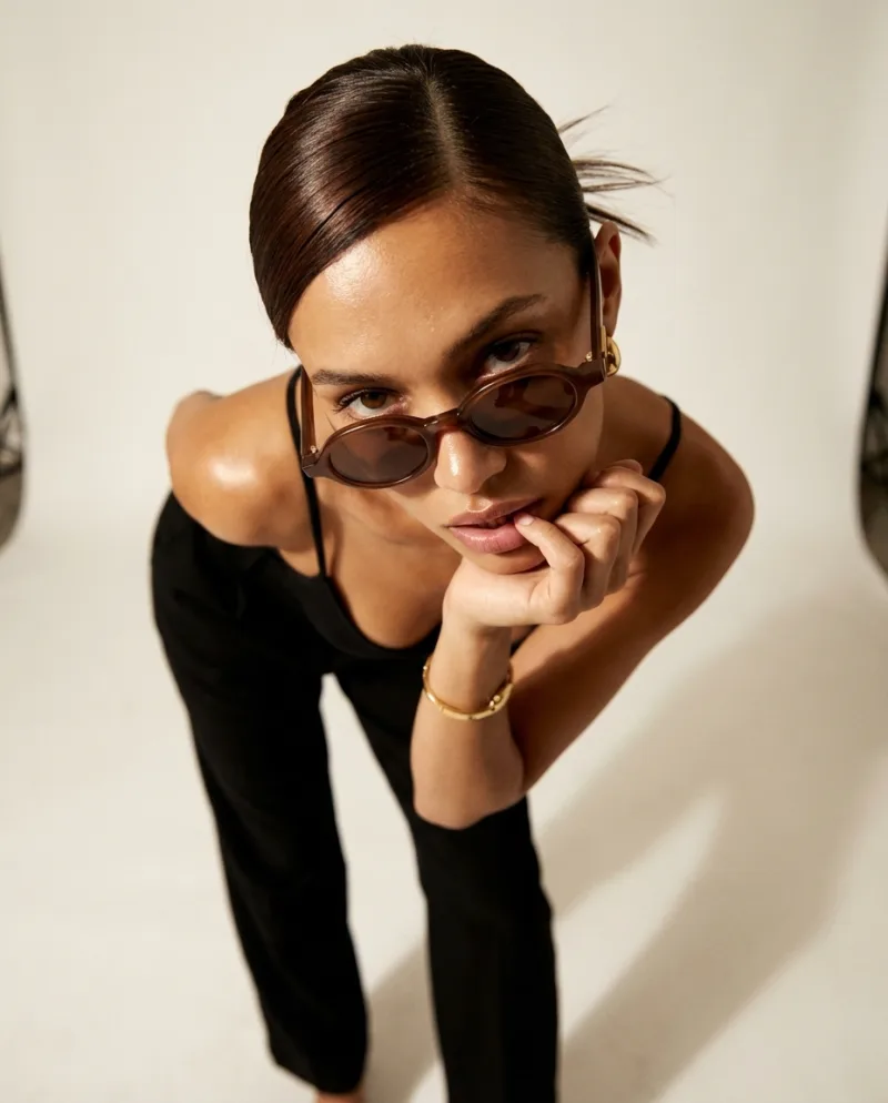 The original generated image, 4:5: sunglasses worn by a model in a studio