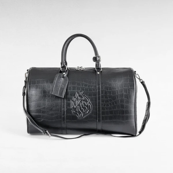 The product photo in the brief: a black croc-embossed duffle bag